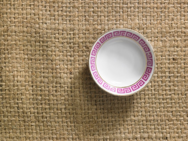 Photo directly above shot of empty plate on burlap