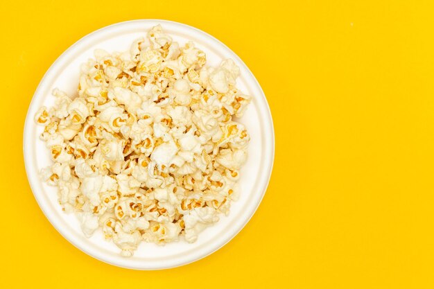 Directly above shot of food in bowl on yellow background