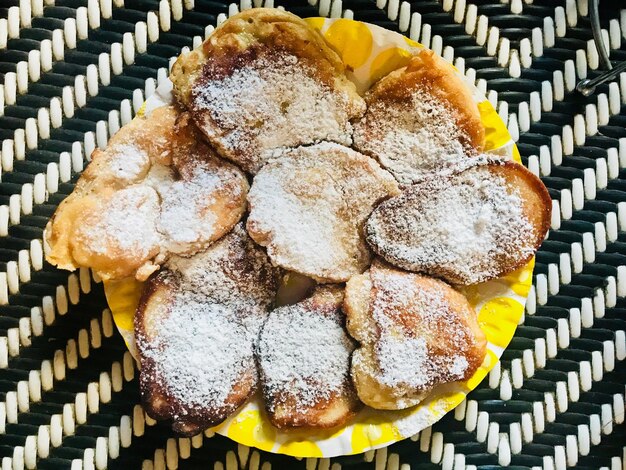 Directly above shot of food with powdered sugar on place mat