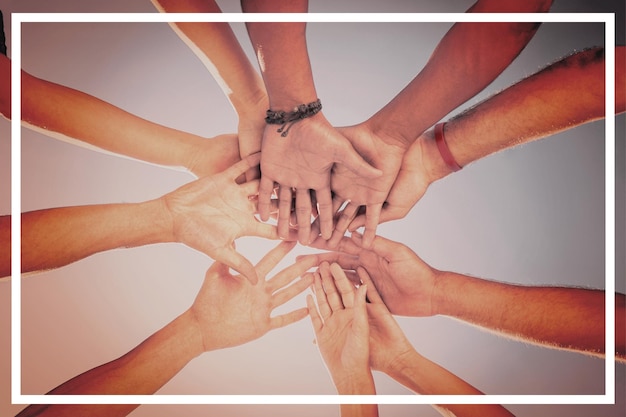 Directly below shot of friends stacking hands