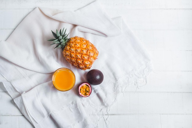 Directly above shot of fruits and orange juice on table