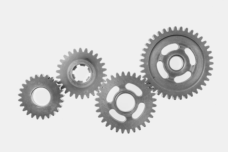 Photo directly above shot of gear wheels against white background