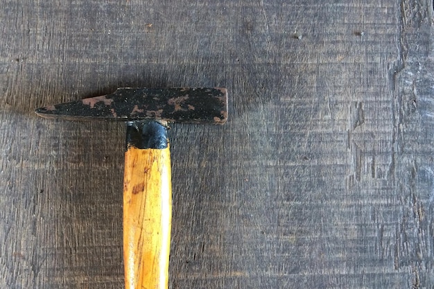 Photo directly above shot of hammer on wooden table