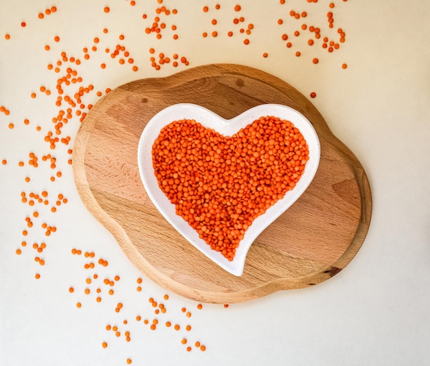 Photo directly above shot of heart shape on table red lentils helps for dark spots
