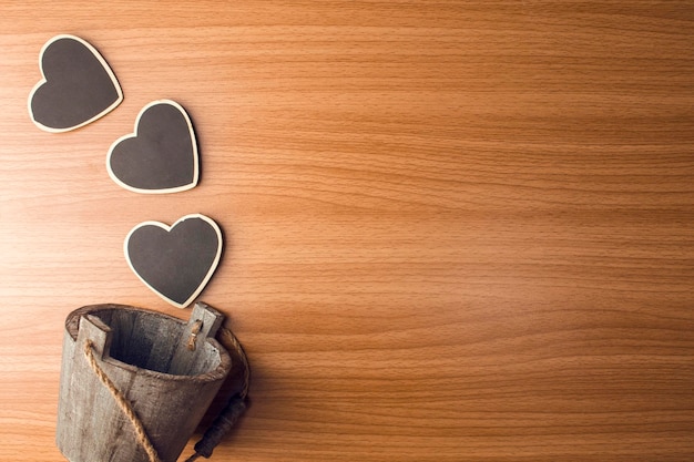 Directly above shot of heart shapes with bucket on table