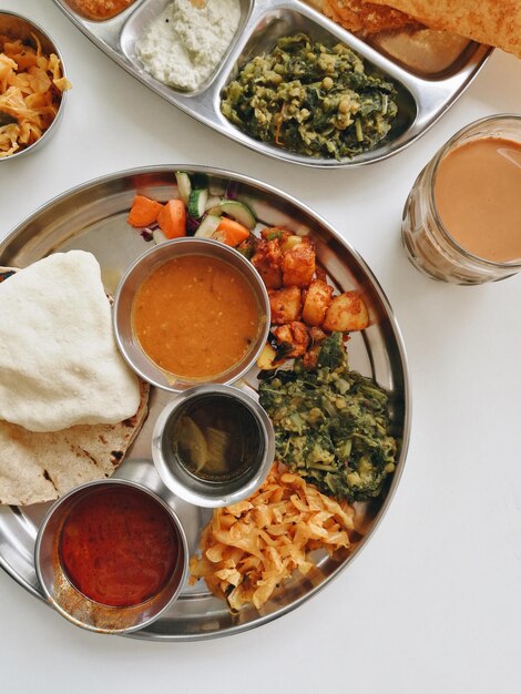 Photo directly above shot of indian food served on table