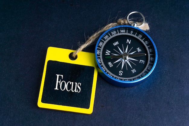 Photo directly above shot of label with navigational compass on table