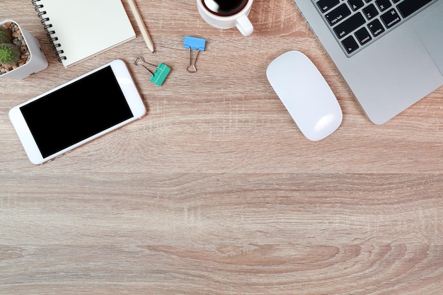 Photo directly above shot of laptop and mobile phone on table