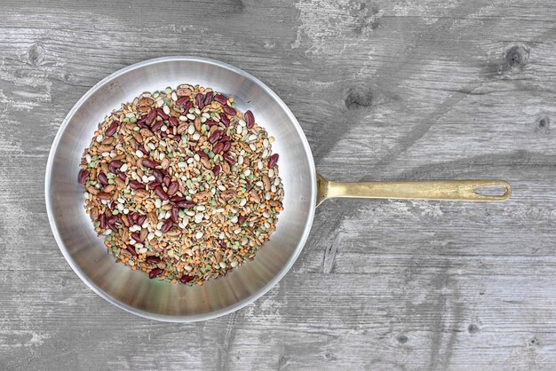 Photo directly above shot of legumes in pan on wooden table