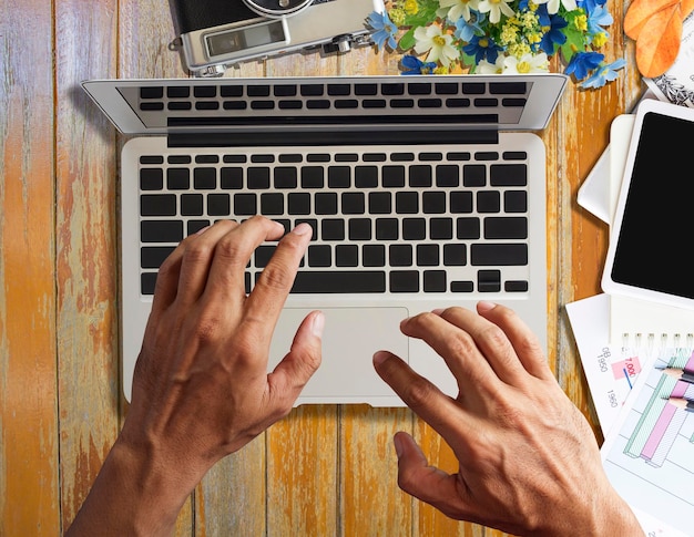 Photo directly above shot of man using laptop