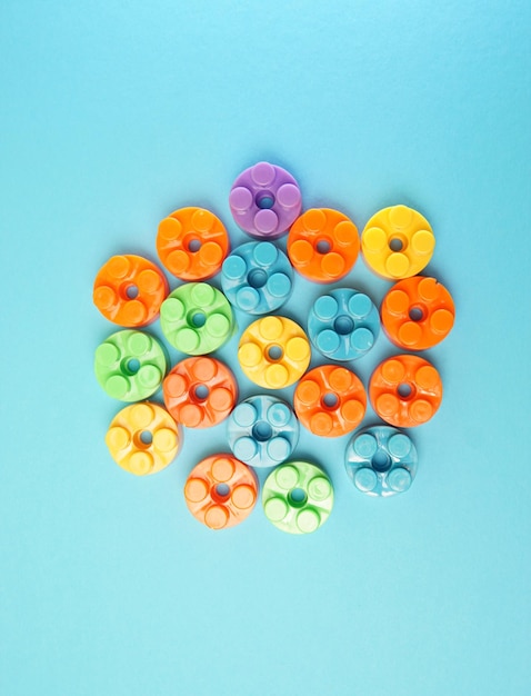 Directly above shot of multi colored candies against blue background