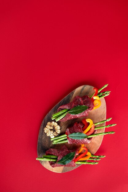 Directly above shot of multi colored fruit against red background