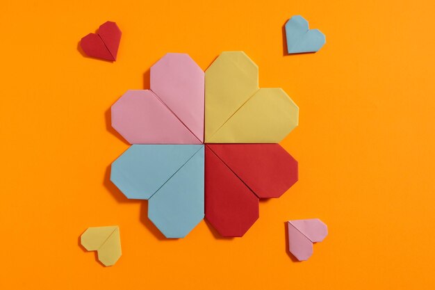 Directly above shot of multi colored umbrella on yellow paper