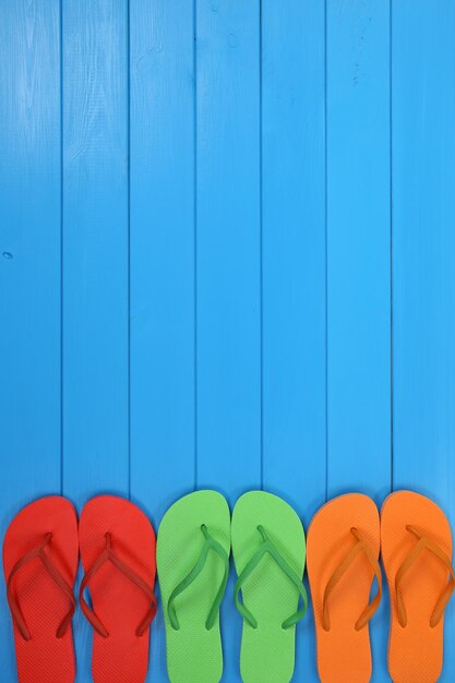 Directly above shot of multi colored umbrellas on blue wall