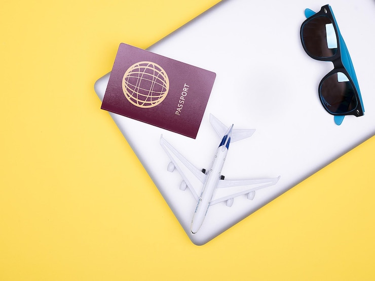 Photo directly above shot of navigational compass on yellow background