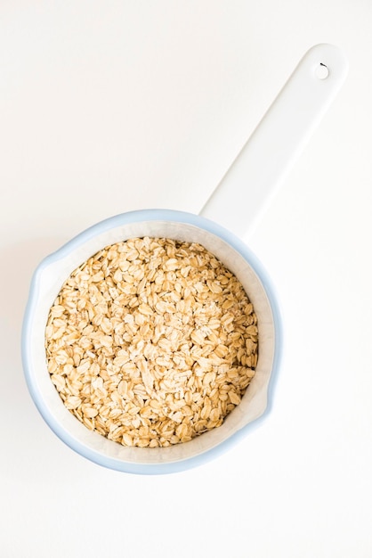 Photo directly above shot of oats in bowl on white background