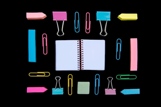 directly above shot of office supplies against black background