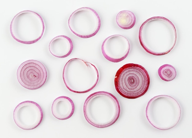 Photo directly above shot of onion slices arranged on white background