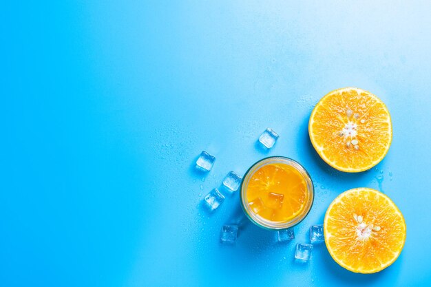 Directly above shot of orange fruits against blue background