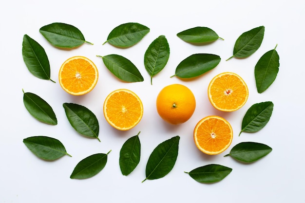 Photo directly above shot of orange fruits and leaves on white background