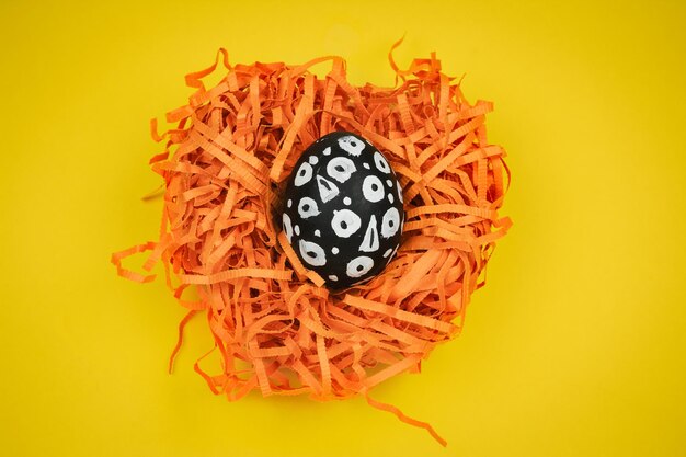 Directly above shot of orange leaf on yellow background