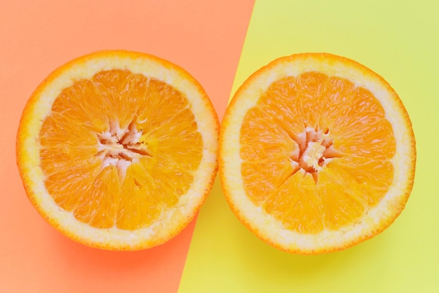 Directly above shot of orange slices on colored background