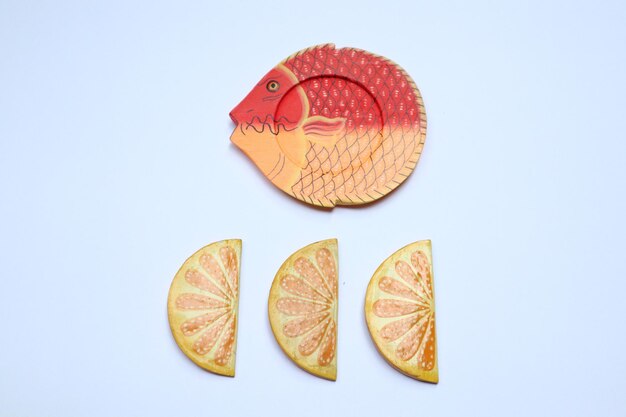 Photo directly above shot of orange slices over white background