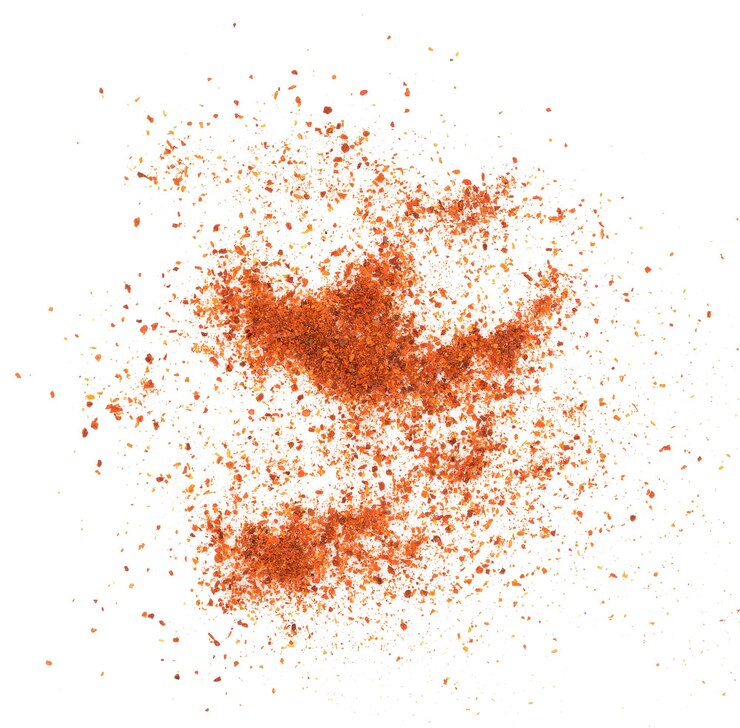 Photo directly above shot of paprika powder on white background