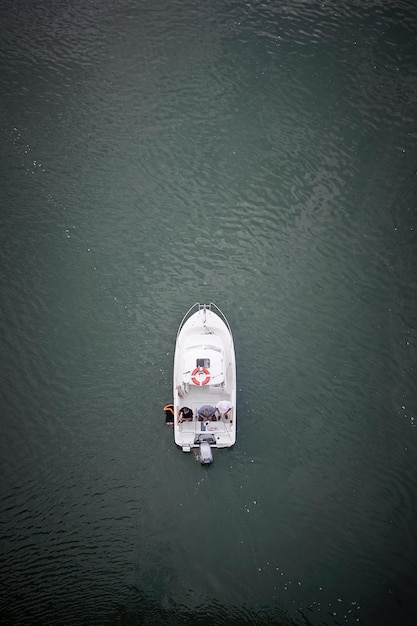 Photo directly above shot of people fishing in boat on sea