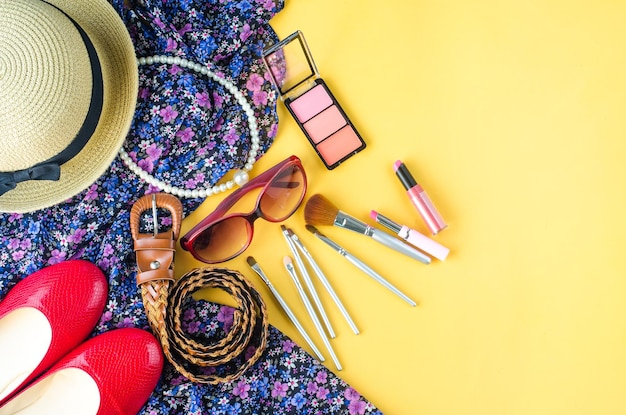 Photo directly above shot of personal accessories on yellow background