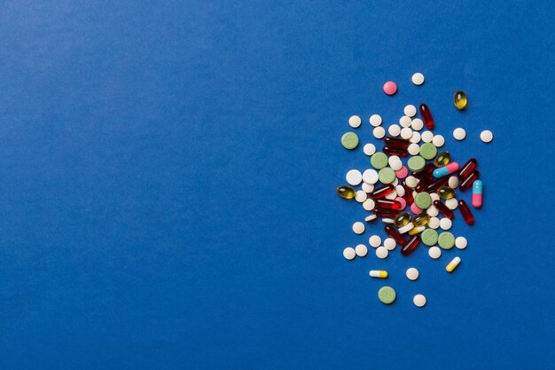 Directly above shot of pills on blue background