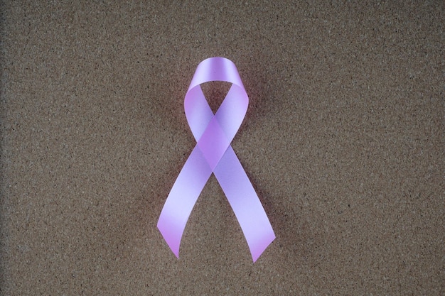 Photo directly above shot of purple ribbon on sand