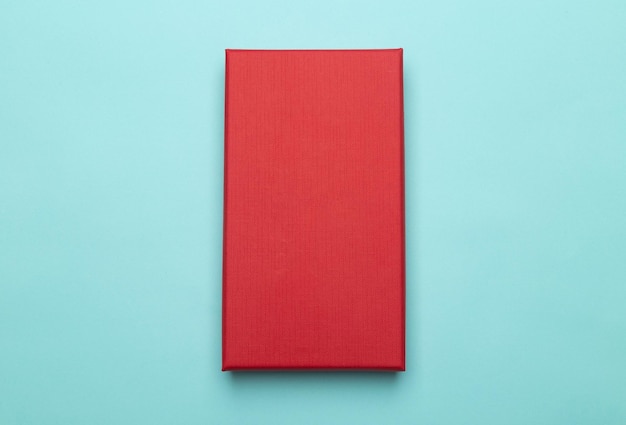 Photo directly above shot of red open book against white background