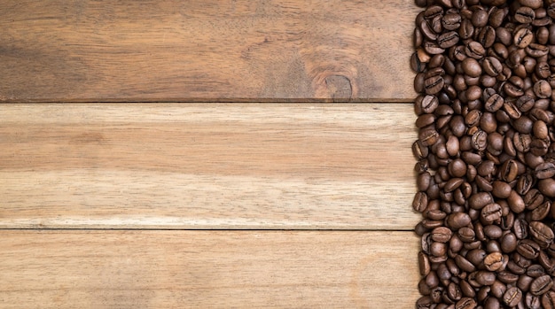 Directly above shot of roasted coffee beans on wooden table
