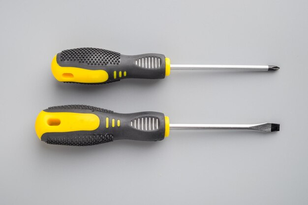 Photo directly above shot of screwdriver against gray background