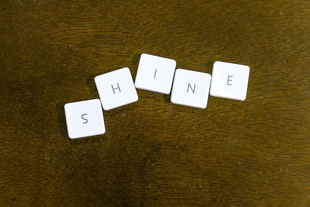 Photo directly above shot of shine text on table