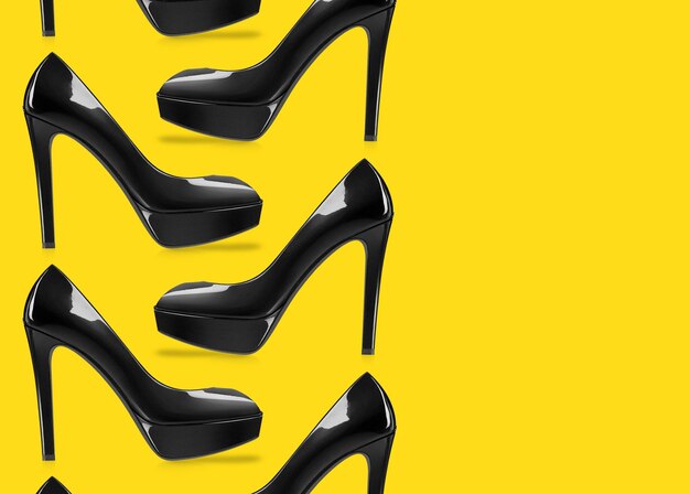 Directly above shot of shoes against yellow background