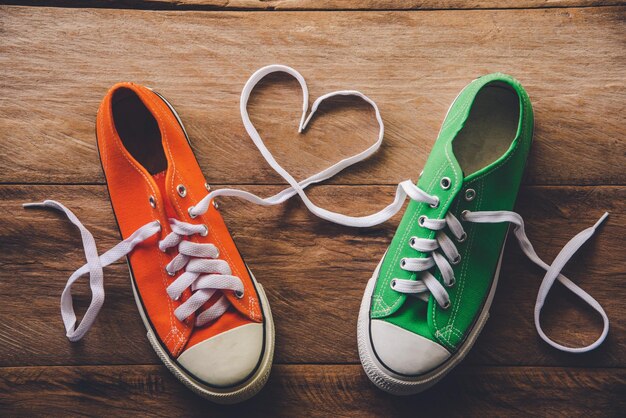 Directly above shot of shoes on hardwood floor