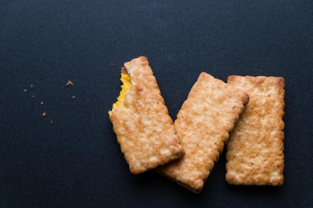 Photo directly above shot of snacks on black table