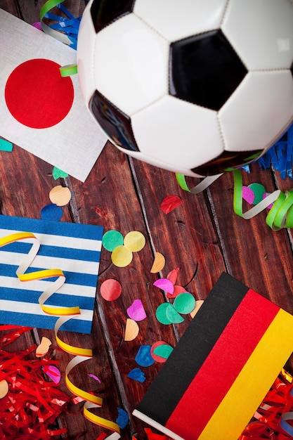 Directly above shot of soccer ball and flags on table