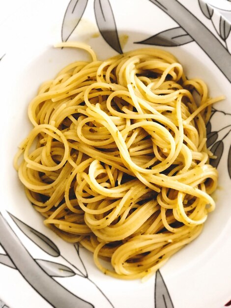 Photo directly above shot of spaghetti served in bowl