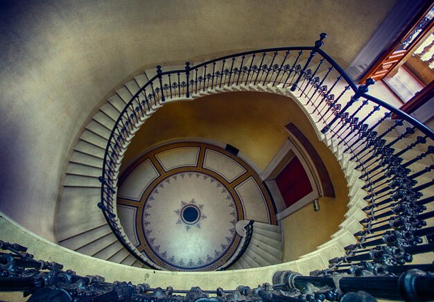 Photo directly below shot of spiral staircase in building