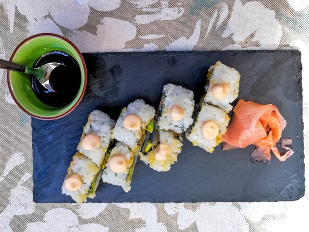 Directly above shot of sushi on stone plate