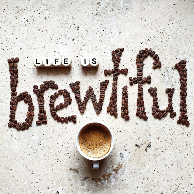 Directly above shot of text made with coffee beans on stone table