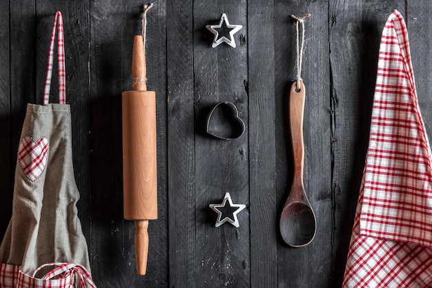 Photo directly above shot of utensils with apron and napkin on table