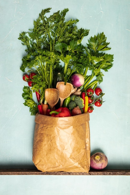 directly above shot of vegetables in paper bag on table