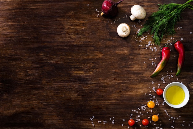 Directly above shot of vegetables with salt on table