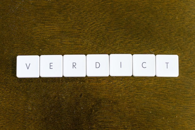 directly above shot of verdict text on table