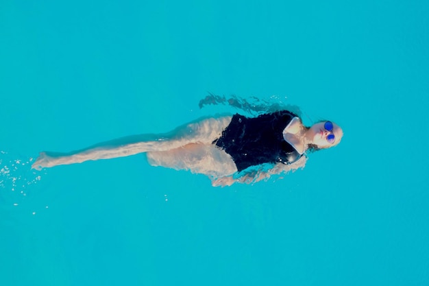 Photo directly above shot of woman in swimming pool