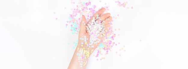 Photo directly above shot of woman with multi colored sequins